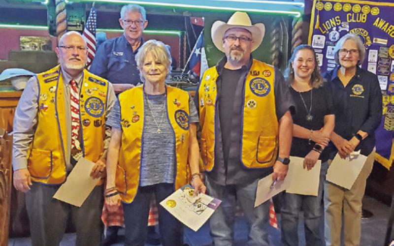 PAST DISTRICT GOVERNOR Joe Franks, back center, inducts new members with their sponsors, Ken Wiltz, Kathy Tollefson, Jason Rhodes, Kelli Coleman and Pat Drouilhet. Photo courtesy of CBC Lions Club