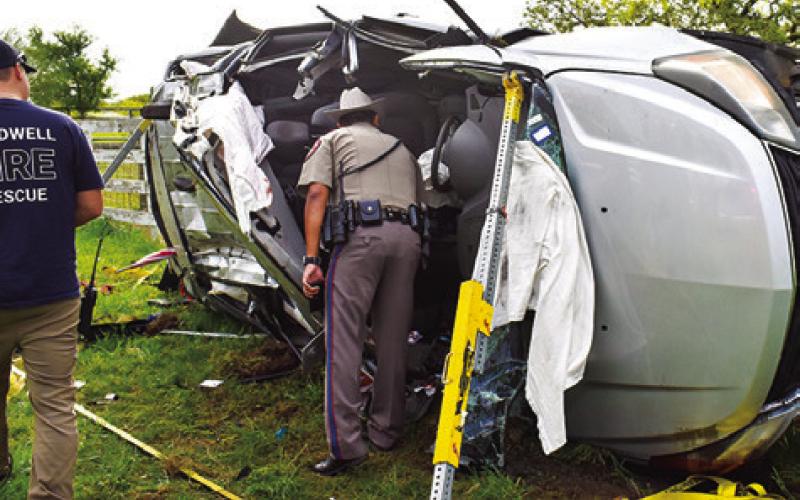 A DPS TROOPER investigates at this Monday morning accident on F.M. 60 West near Park Road 4. The driver was flown from the scene by an AirMed helicopter crew. No details were available at press time.