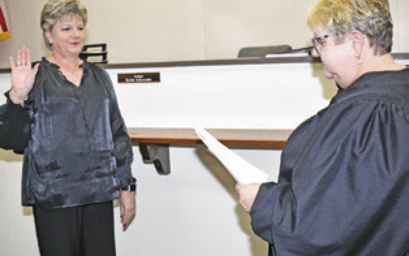ANNA SCHIELACK IS sworn into office on Jan. 1 as Burleson County Clerk by District Judge Reva Towslee Corbett.