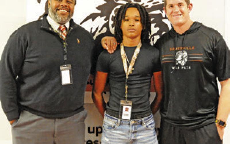 SOMERVILLE HIGH JUMPER Jeremy Vela will be competing this Friday, beginning at 11:30 a.m., at the UIL State Track &amp;amp; Field Meet in Austin. He is pictured with Somerville High School Principal Steven Toliver and Somerville Athletic Director Luke Klingler. Tribune photo by Denise Squier