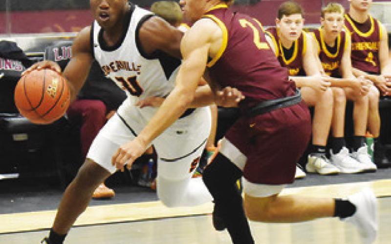 JA’KEITH DANIELS dribbles the ball around this Thorndale defender at the tournament. Tribune photo by Roy Sanders