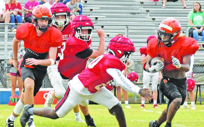 SOMERVILLE’S HERSCHEL CONWAY carries the ball against Rosehill Christian School. Also pictured is blocker Kutter Rohrbach.