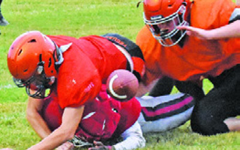 SOMERVILLE DEFENDERS make a tackle as the ball comes loose against Rosehill Christian School. -- Tribune photo by Roy Sanders