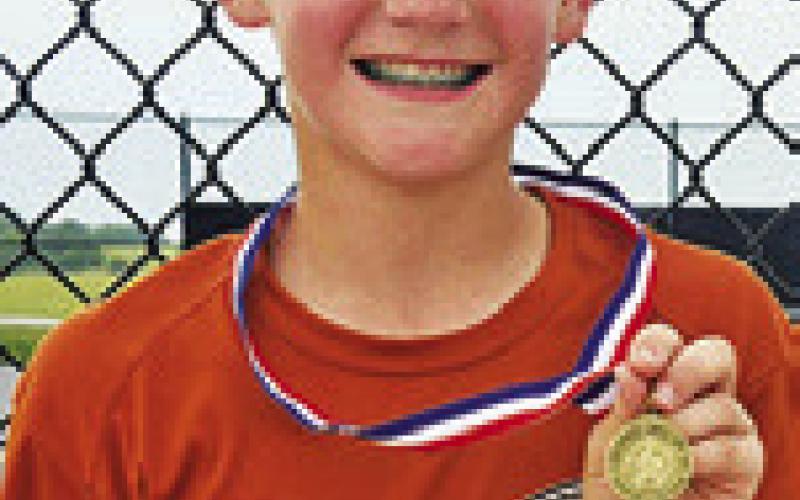 LANDON VYKUKAL earned the eighthgrade Division A boys singles title at the junior high tennis championships.