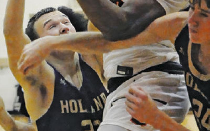 JA’KEITH DANIELS takes a shot against Holland. The Yeguas won 64-15. Tribune photo by Denise Squier