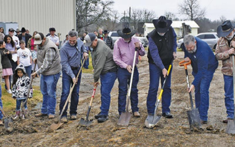 MEMBERS OF THE BURLESON County Cowboy Church formally break ground on Sunday, Jan. 26, for the church’s new fellowship and education building located behind the church. Tribune photo by Roy Sanders