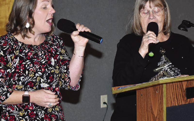 JENNIFER HUBER AND Gayla Townsend sing on Saturday, Dec. 6, at the First United Methodist Church Angel Tea.