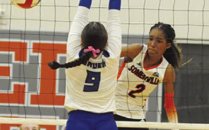 KARYS ELLIS gets a kill past Kalyn Cooper during the Somerville-Snook play-in match for play-off seeding on Monday in Caldwell.