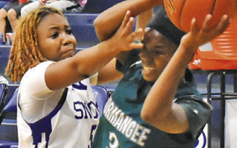 BRAYNIJA POOL DEFENDS the pass during the Snook-Normangee game last Friday. Tribune photo by Roy Sanders