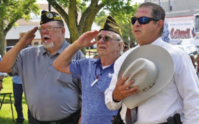 JOHN MAYSON, HENRY Probst and Sheriff Bill Rios pay respects as the American flag is raised during the Memorial Day ceremony.