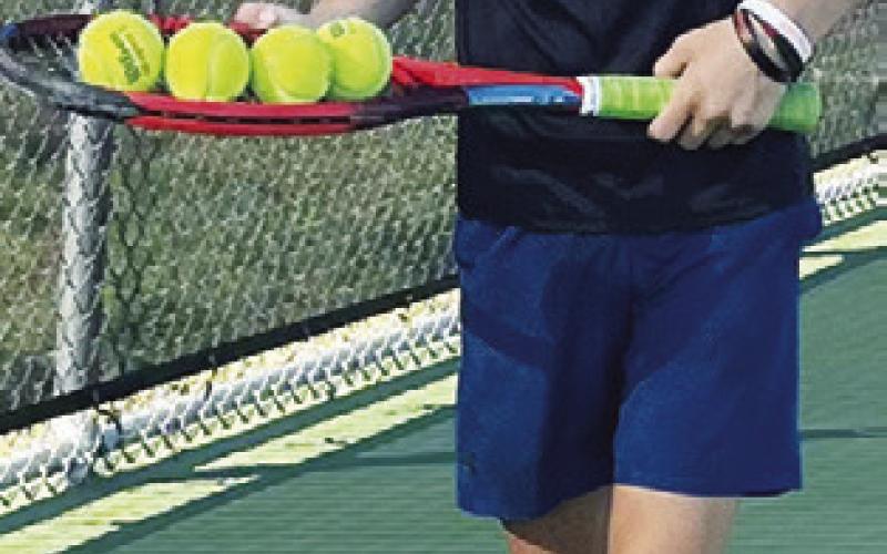 “LOOKOUT WORLD! I’m enjoying Hornet Tennis Camp.”