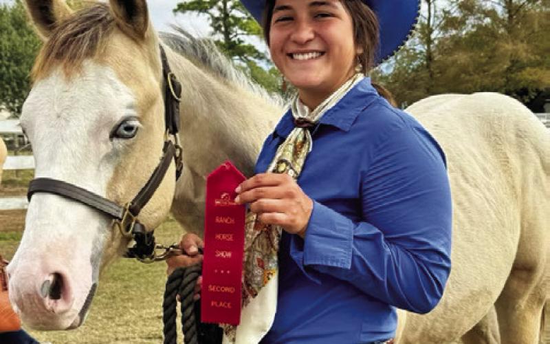 LEFTYA IN MY DUST, A 2025 APHA stallion, earned two world championship titles and the reserve high point young horse title in the OHSA Virtual World Show with Sabine Lazo of Caldwell leading. Photo courtesy of Elicia Rogers