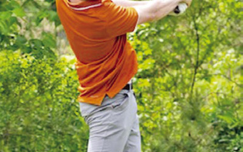 HARRISON NOVAK hits a tee shot at the regional golf tournament in Huntsville.