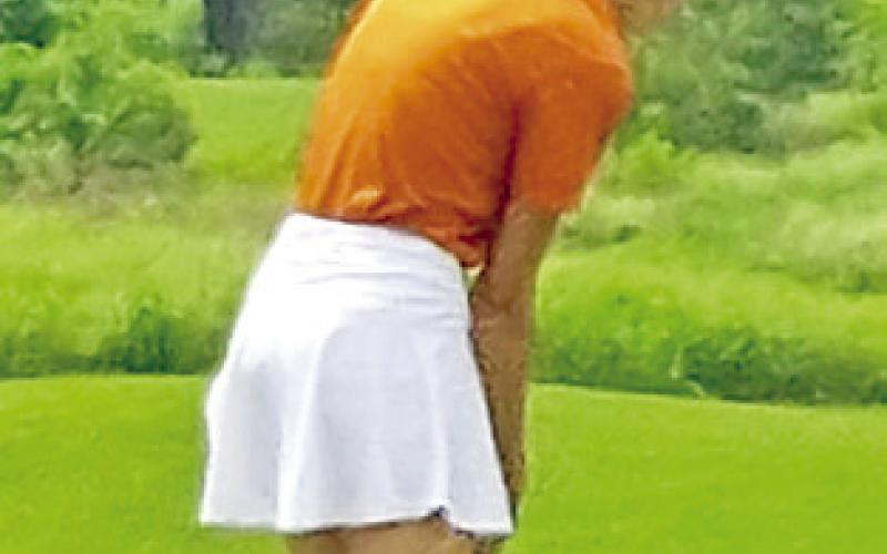 MADILYN SCHNEIDER putts for the Caldwell Lady Hornets golf team last week at the regional tournament in Huntsville.
