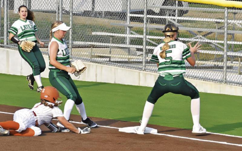 CALDWELL’S KAMERYN HILL tries to get back to first base during the Caldwell-Latexo game last Friday at Lady Hornet Field. -- Tribune photo by Roy Sanders