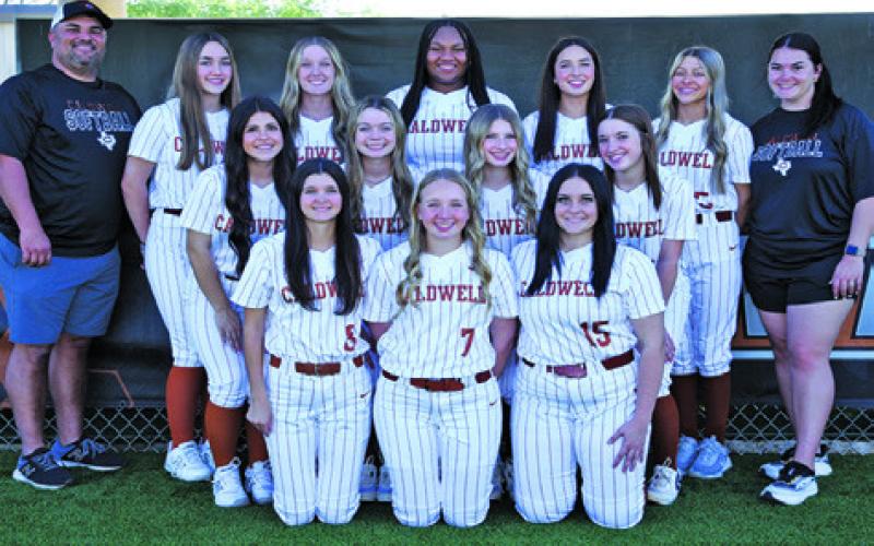 THE 2025 LADY HORNET VARSITY softball team is, from left, front, Jillian Vykukal, Mia Witherwax, Callie Fletcher, middle, Jaelynn Gest, Kameryn Hill, Mayzi Witherwax, Abby Lopez, back, Coach Marcus Escalante, Tatum Supak, Molly Meadows, Samone Clark, Brynn Morton, Emma Gregory and Coach Delaney Loosmore.