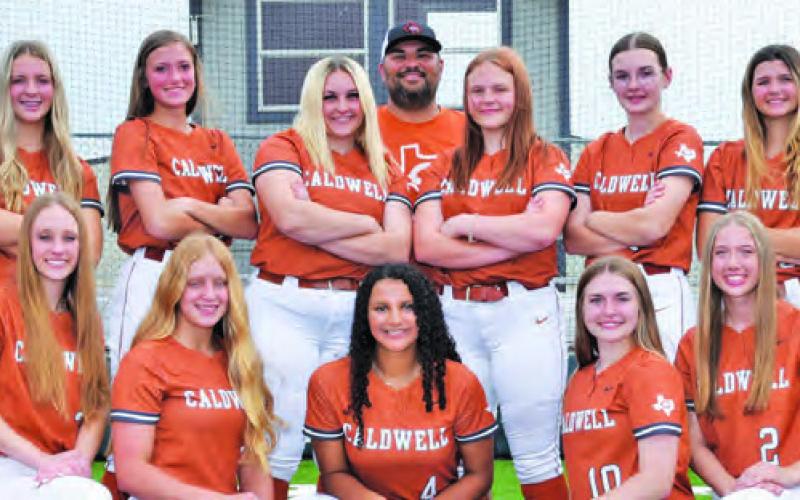 THE 2023 CALDWELL HIGH SCHOOL LADY HORNET VARSITY softball team is, from left, front, Breann Sims, Avery Smith, Caitlyn Faust, Aliyah Vela, Kelly Urbanovsky, Otylia Hicks, Kaylee Crump, back, Coach Wendy Weiss, Adeline Hicks, Hadleigh Novosad, Kysen Toney, Callie Fletcher, Coach Marcus Escalante, Emily Smith, Larissa Foster, Jillian Vykukal, Tanzley Johnson and Coach Kara Stewart. -- Photo courtesy of Dianne Pursch Photography