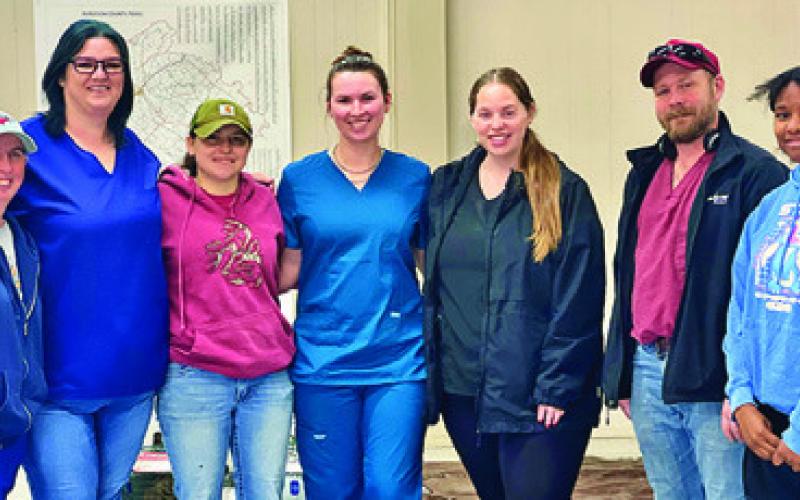 PROJECT SNIP OFFICIALS AND veterinary staff pictured at the Monday, April 6, spay/neuter clinic. Tribune photo by Sabine Lazo