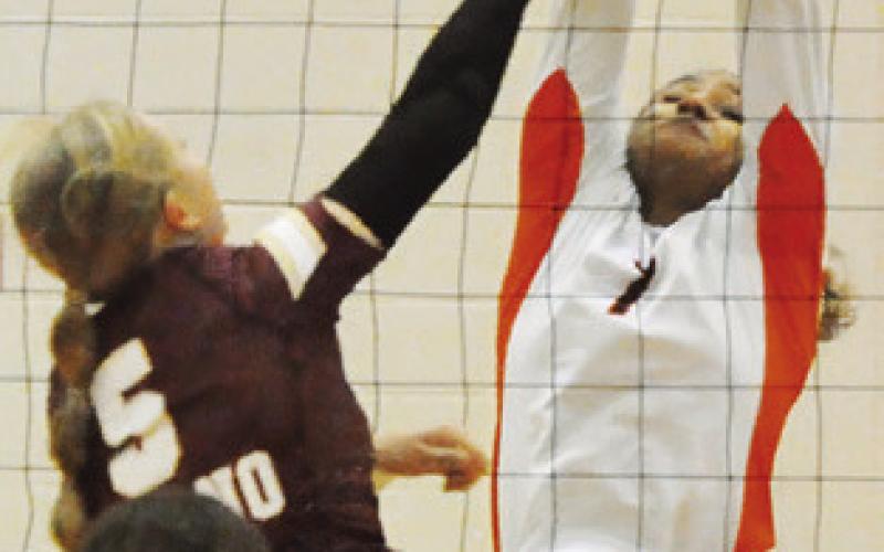 EMMA WILLIAMS blocks a Milano hit during the Somerville-Milano match last week.