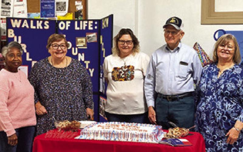 BURLESON COUNTY HISTORICAL Commission members gather around the county’s birthday cake. They include, from left, Amy Jurica, Mahalia Nix, Melynda Giesenschlag, Melissa Weichert, Tommy Ryan, Gayla Townsend and Diann Scott.