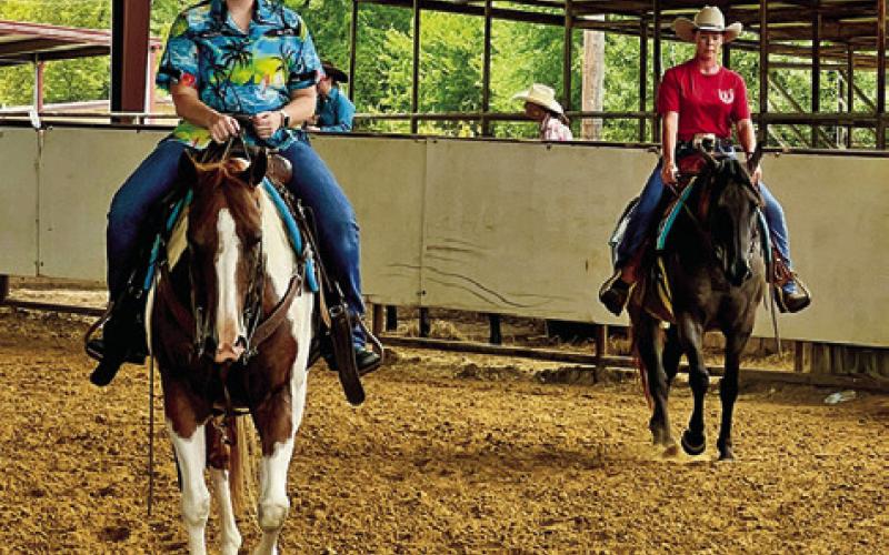 EXHIBITORS AT THE TRIBUTE TO Thomas horse show in Caldwell wore Thomas’s favorite colors -- blue and red. Tribune photo by Sabine Lazo