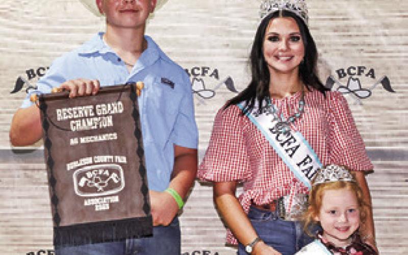 COULTER SUEHS EXHIBITED the Reserve Champion Ag Mech project at the 2025 Burleson County Fair. Also pictured are Burleson County Fair Queen Kodi Hitchcock and Little Miss Taytum Hohlt.