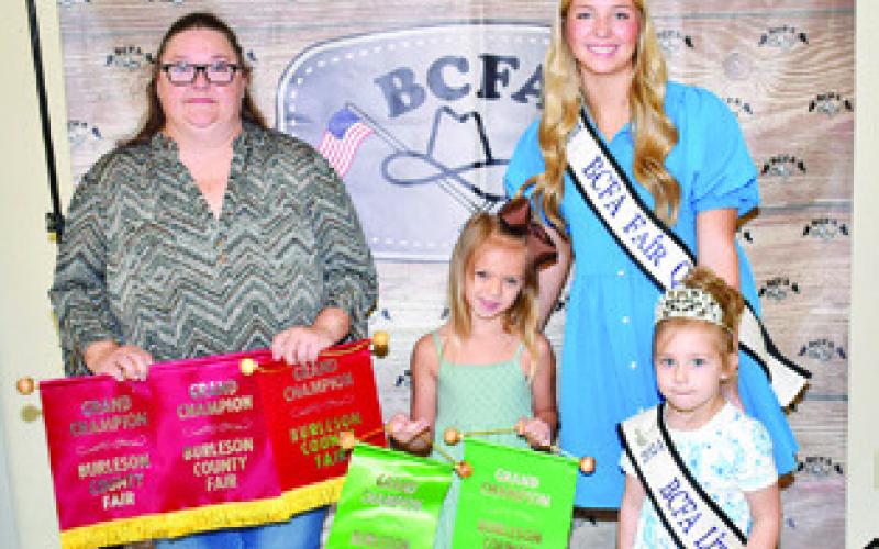 VICTORIA SCHMIDT WON grand champion for photography and bloopers at the Burleson County Fair, and Brittan Blum won for embellished wear- apron, embellished-pumpkin wood crows, cut specimens sand potted plants. Joining them are Burleson County Fair Queen Hadleigh Novosad and Little Miss Avery Grace Freeman.