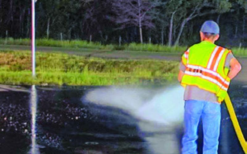 SNOOK VOLUNTEER Fire Department personnel washed down roads around Chilifest, removing mud to improve road safety until around 3 a.m. on Saturday. The Saturday events were canceled. Photo courtesy of Snook VFD