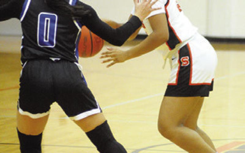 EMMA WILLIAMS dribbles past a Mumford player during the Lady Yeguas’ game against Mumford last Friday night. Tribune photo by Denise Squier