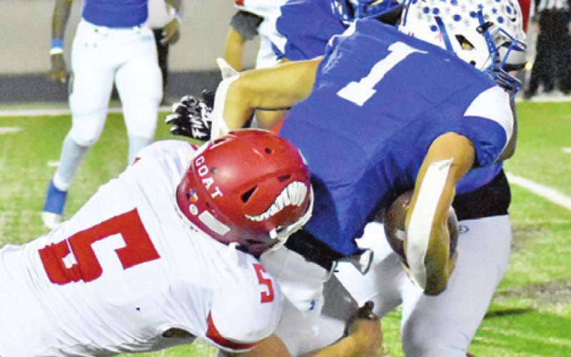 A ROCKSPRINGS DEFENDER makes a tackle against Snook.