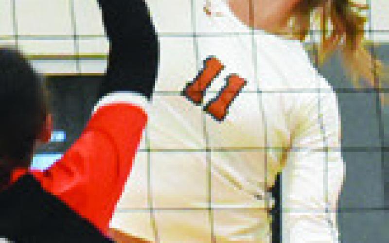 REESE MCMANUS gets one of her 20 kills against Smithville on Friday in Hornet Gym. Tribune photo by Roy Sanders