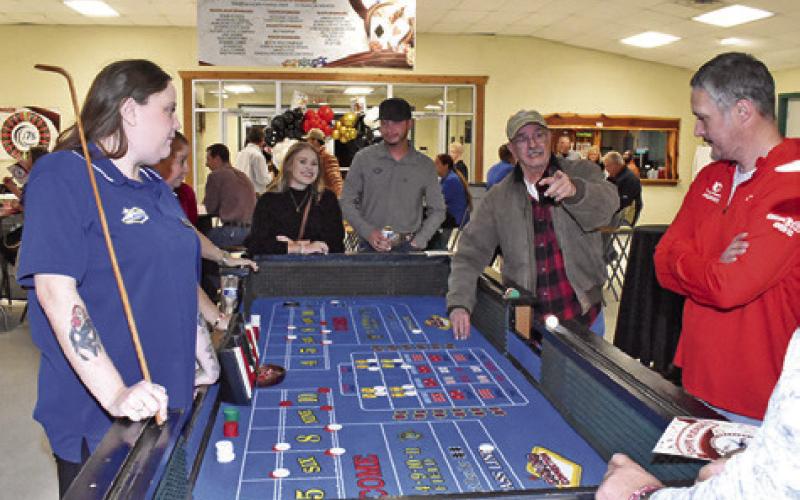 THE ROTARY CLUB Casino Night is enjoyed by local residents last Saturday night, Jan. 16, at the Burleson County Expo Center.