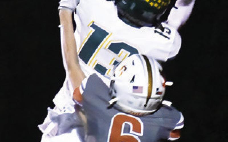 KYSON STRANGE defends for Caldwell on this Lexington pass reception. Tribune photo by Roy Sanders