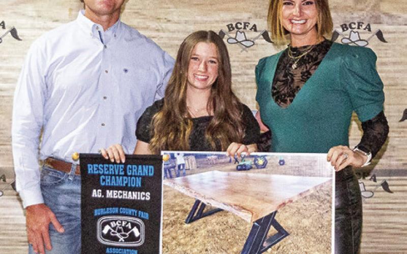 RESERVE GRAND CHAMPION in Ag Mechanics, Adeline Hicks is pictured with Devin and Makala Gerland. Photo courtesy of Jeffries Livestock Marketing