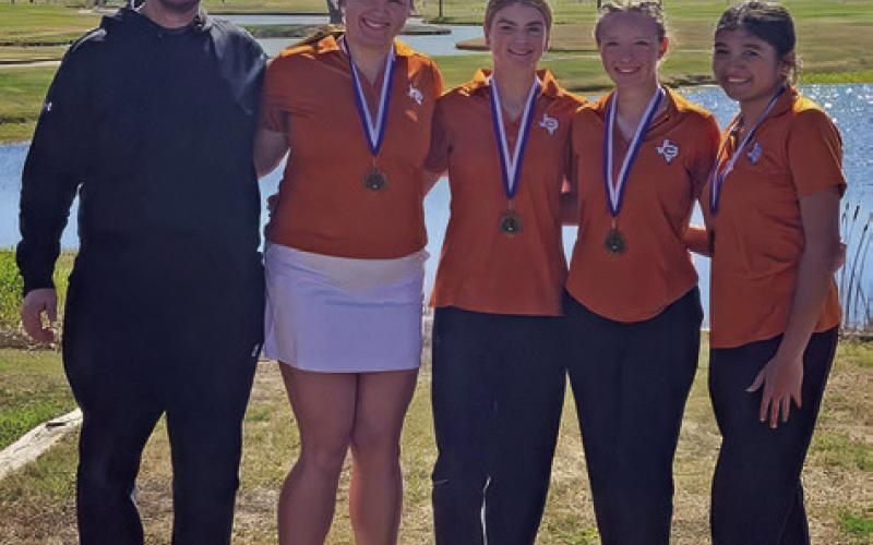 CALDWELL GOLF COACH Jacob Schaefer joins girls team members Kierstyn Macik, Jordyn Hafernick, Alexa Johnson and Patsy Pineda. The girls team placed third at the Navasota Tournament.