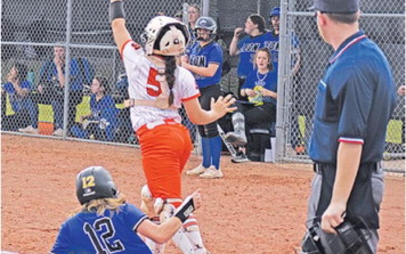 SOMERVILLE’S AVERIE HERNANDEZ catches the ball while a Leon runner slides into home plate last Friday during the Somerville-Leon bi-district game.