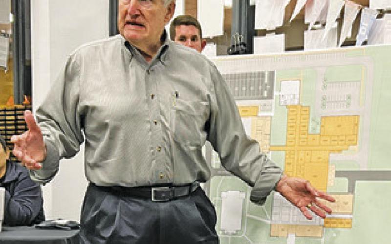 JIM SINGLETON with SZS Architecture presented schematic drawings of what SISD campuses could look like in the near future. Tribune photo by Denise Squier