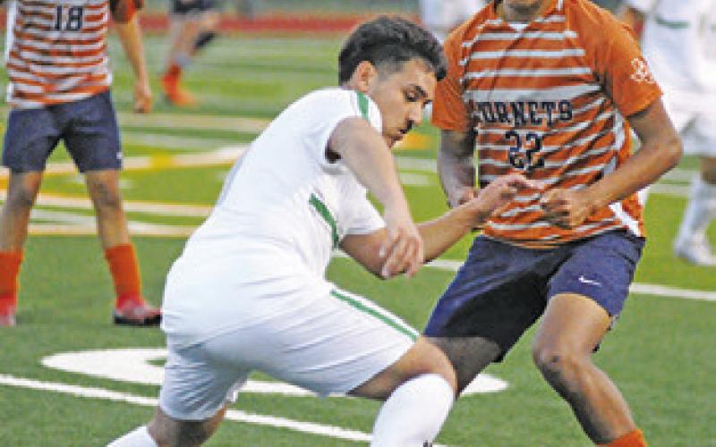 JEFFRY TOBIAS and a Taylor player fight for possession of the ball during the Caldwell-Taylor game on Friday at Hornet Field.