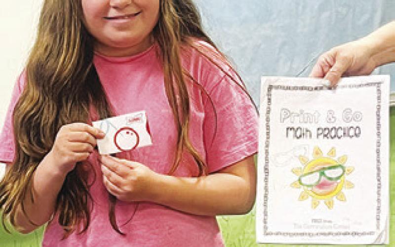 ALLY WRIGHT completed her 100-page math packet from First Baptist School’s summer program.