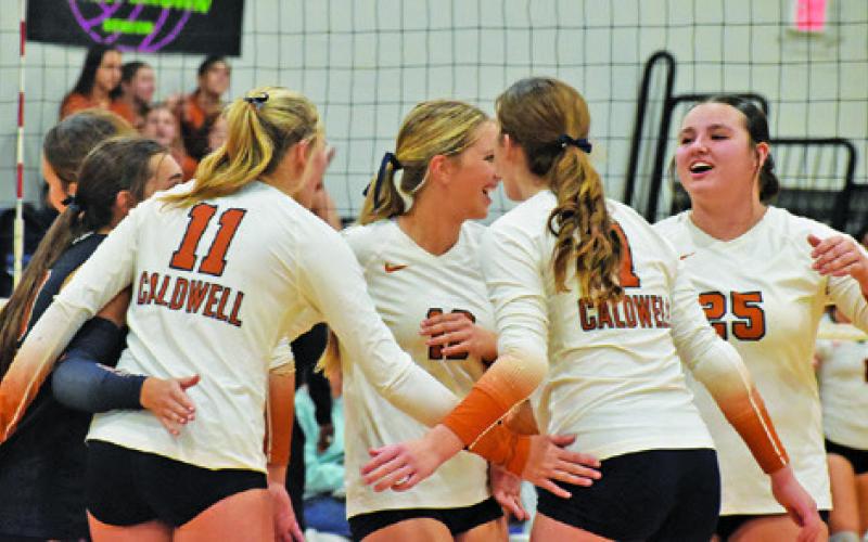 THE LADY HORNETS CELEBRATED after their victory over Smithville Friday night. Tribune photo by Roy Sanders