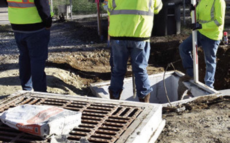 A CONSTRUCTION CREW works on drainage on Friday, Jan. 16, at F.M. 975 in Caldwell. TxDOT is rebuilding the road.