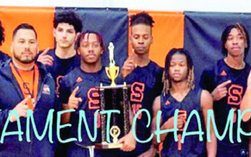 THE SOMERVILLE YEGUAS hold their championship trophy from the Koppers Tournament.
