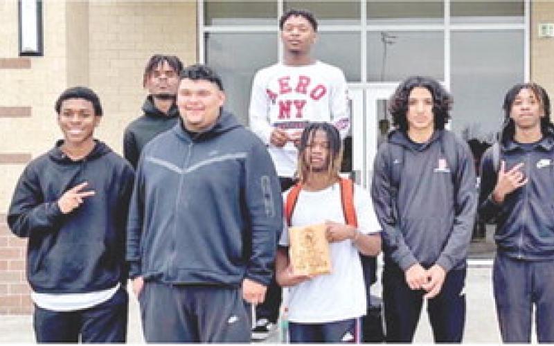 THE SOMERVILLE YEGUAS DISPLAY their third place plaque from the Bremond Tourney.
