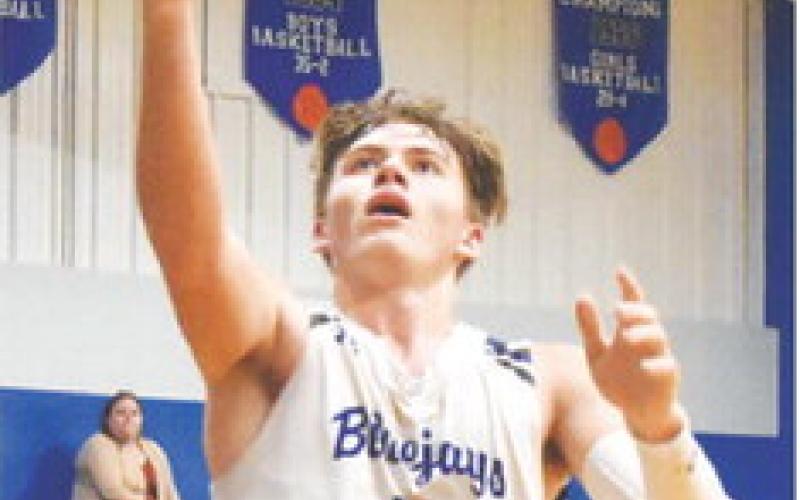 SNOOK’S SAM Smitherman takes a shot against Bruceville Eddy last Friday. Snook won 75-31. -- Tribune photo by Roy Sanders