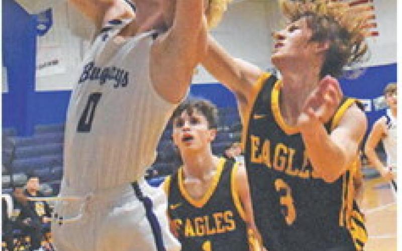 LIAM ZEQUERIA of Snook takes a shot despite some defensive pressure against Bruceville Eddy. Snook won 75-31.
