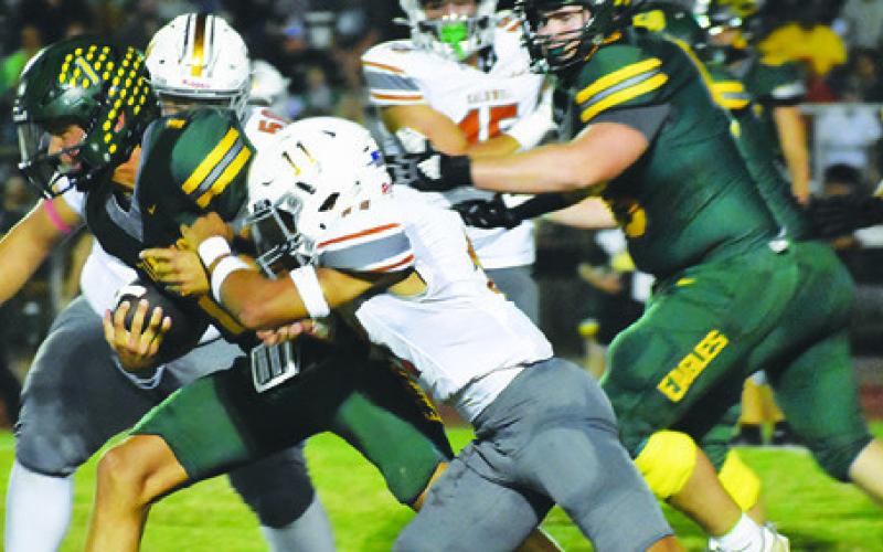 ZANE BROWN OF Caldwell moves in for a tackle against Lexington last Friday in Lexington. The Hornets open district Friday at Giddings. Tribune photo by Roy Sanders