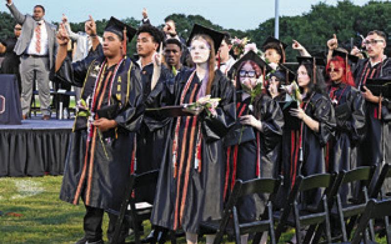 SOMERVILLE CLASS OF 2026 and those in attendance at Friday night’s graduation ceremony sing the school song. Tribune photo by Denise Squier