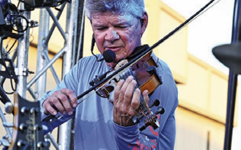 EVERYONE LOVED the fiddle during Texas Unlimited Band’s performance at Main Street Caldwell’s “Summer Concert Series.” Tribune photo by Denise Squier