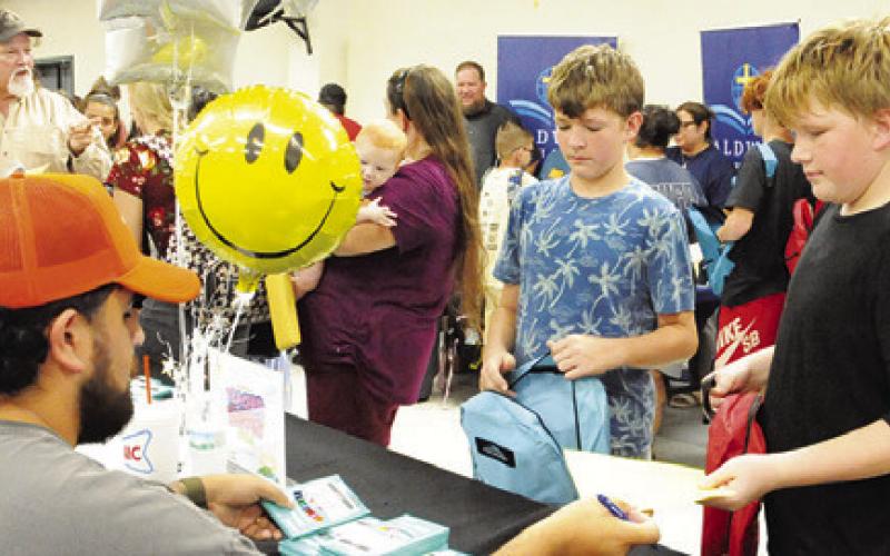 COLORED PENCILS AND MORE were passed out at Monday’s “Back-to-School Blast” at the Burleson County Expo Center. Tribune photo by Denise Squier