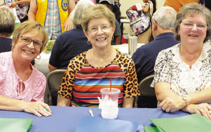 NEWTABORBRETHRENCHURCHmembers are ready to give out folders at Monday’s “Back-to-School Blast” at the Burleson County Expo Center. Tribune photo by Denise Squier